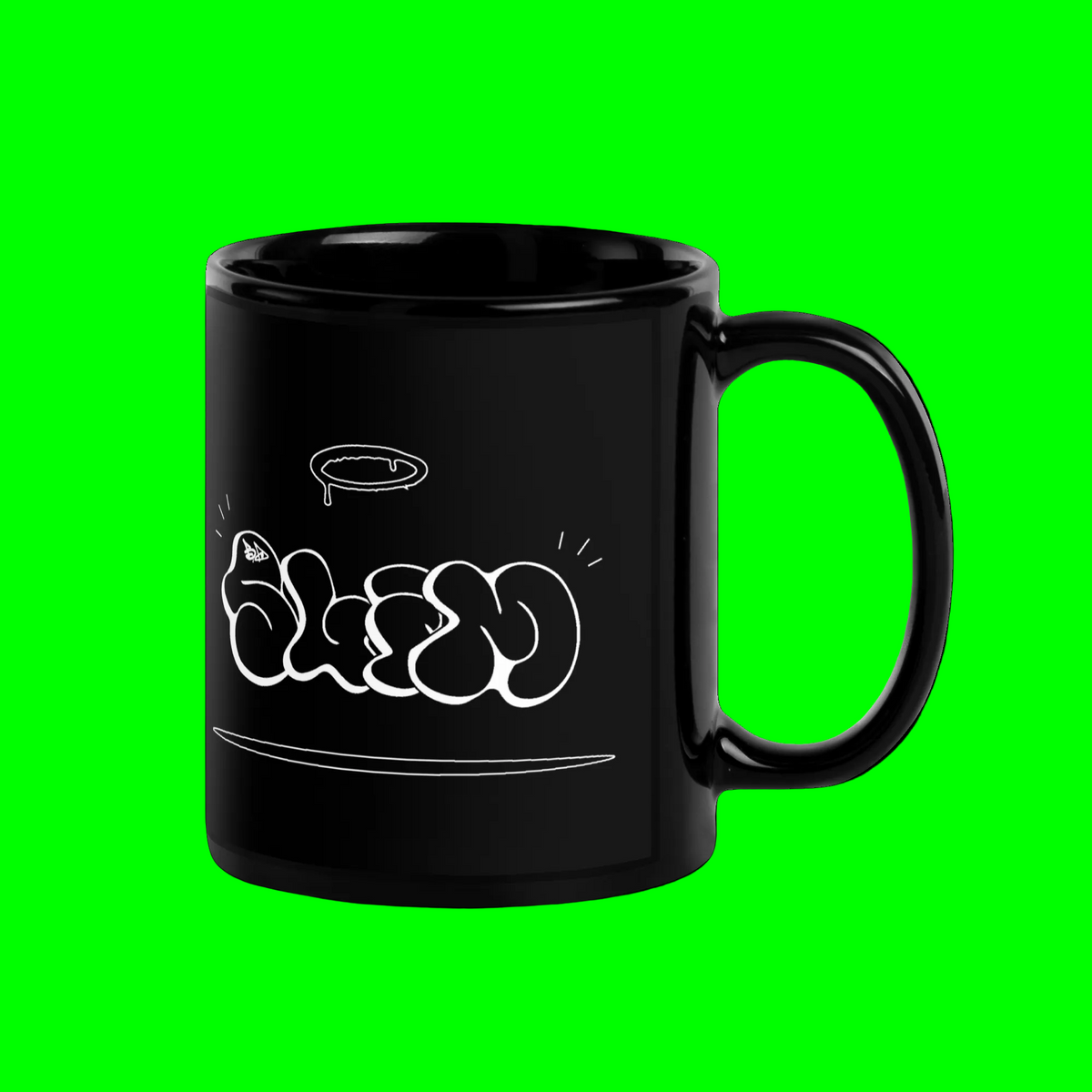 A glossy black ceramic mug with a white graffiti-style bubble lettering graphic on the side, set against a solid bright green background.